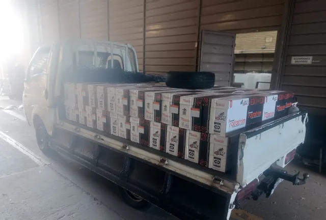 Boxed goods neatly stacked and strapped on a Lewin Projects bakkie ready for a commercial goods delivery